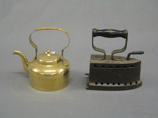 A brass kettle, a box iron, a large heavy brass spicket and sundry brassware