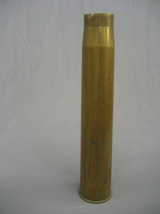 A large brass shell case marked 37" gun 1939