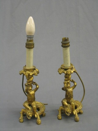 A  handsome pair of gilt Ormolu table lamps in the form of seated cherubs upon crocodiles 13"