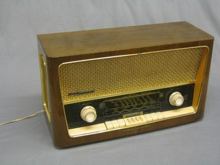 A Grundig 3D sound radio in a walnut case