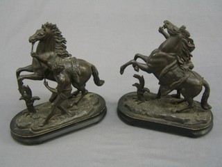 A pair of Victorian Marley horses raised on oval stands 12" (1 f)