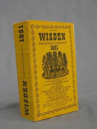 A 1951 edition of Wisden (paper covers)