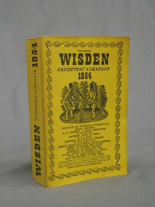 A 1954 edition of Wisden (paper covers)