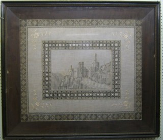 A Victorian lace picture depicting a castle 23" x 27 1/2" contained in a Hogarth frame