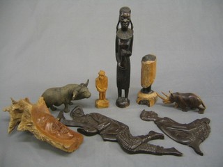 An Eastern carved figure and a collection of ethnic carved figures
