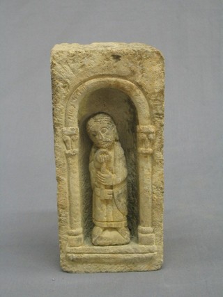 A 19th Century carved stone niche with a figure of St Peter, 6"