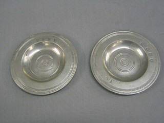 2 18th Century circular pewter dishes, front with rampant lion within a shield, the reverse marked Alford, 4 1/2"