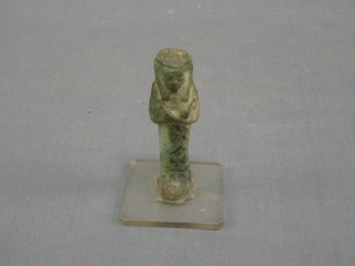 An Egyptian figure of Ustapli, raised on a perspex base 3 1/2"