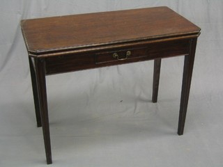 A 19th Century Country oak tea table, fitted a drawer, raised on square tapering supports 36"