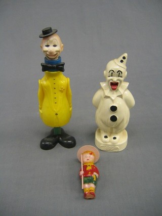 A celluloid figure of a scout 3", do. clown and 1 other