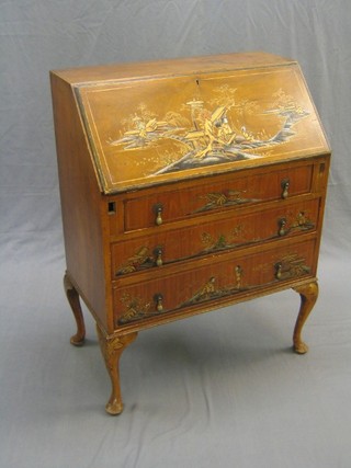 A 1930's walnut chinoiserie style bureau with fall front revealing a fitted interior above 3 long graduated drawers (lock previously forced, some minor veneer damage to the side) 30"