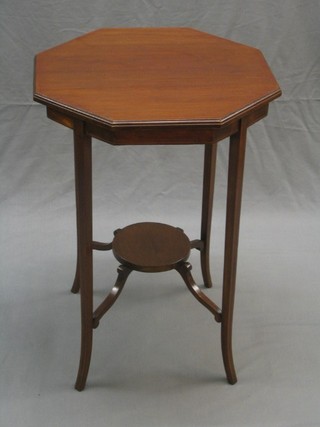An Edwardian octagonal inlaid mahogany 2 tier occasional table raised on outswept supports 20"