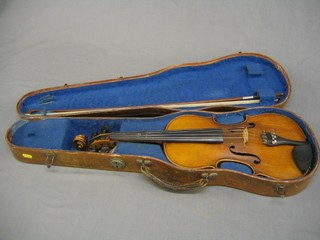 A violin with 2 piece back and labelled Handarbeit Aus Mittenwald (crack to front) contained in a wood effect carrying case