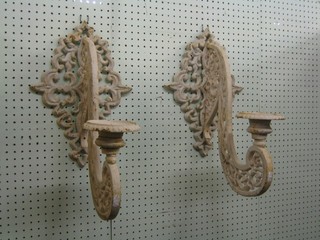 A pair of cast iron pricket wall light brackets