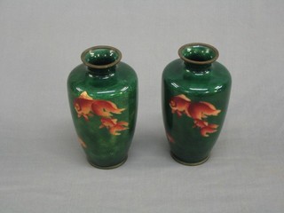 A pair of 19th Century green ground cloisonne vases decorated diving carp, 7" (1f)