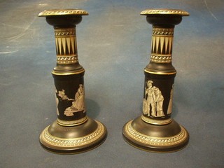 A  pair of Victorian Prattware circular Grecian style black glazed candlesticks 9" (no mark to base) 