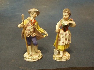 A pair of 19th Century "Meissen" porcelain figures of lady and gentleman gardener, the base with painted blue cross swords mark, incised 60338, 5" (1f and r),