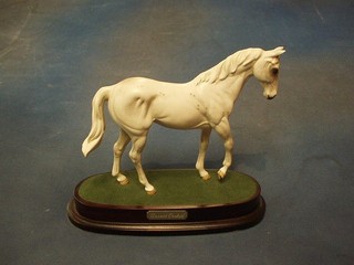 A Royal Doulton limited edition figure of Desert Orchid raised on a wooden base