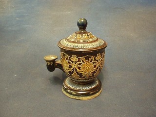 A Doulton Lambeth cylindrical stoneware patented inkwell, the base marked Doulton Lambeth, impressed 521, The Iso Bath, ES, (the finial F and R and with 1 1/2" crack to the base and other minor chips) 7"
