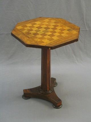 A William IV rosewood octagonal inlaid games table, raised on a chamfered column with triform base, 19" (missing some veneer)