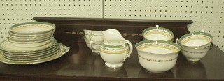 A 21 piece Royal Doulton tea service with green gilt and floral banding comprising sugar bowl, cream jug, twin handled bread plate, 6 tea plates, 6 cups and 6 saucers