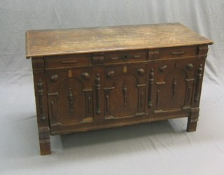 A 17th Century carved oak coffer of joined and panel construction with hinged lid having original hinges, the interior fitted a candle box, raised on panel feet (1 missing) 48"