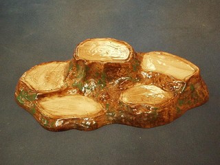 A Beswick Beatrix Potter set stand in the form of a tree stump with 5 recepticals, base marked Beswick, 12"