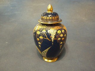 A Carltonware blue lustre globular shaped urn and cover with enamelled decoration, the base impressed 311 8" (slight rubbing to finial)