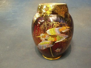 An Art Deco Carltonware red lustre vase of globular form decorated a fabulous bird (chip repaired to rim and some crackling to interior) 8"