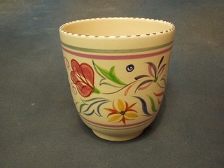A circular Poole Pottery jardiniere with floral decoration, the base with dolphin mark, 6"