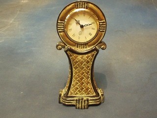 A reproduction Victorian mantel clock in a gilt shaped balloon case 