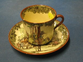 A Royal Doulton seriesware cup and saucer decorated cottage with figures (cup crazed)