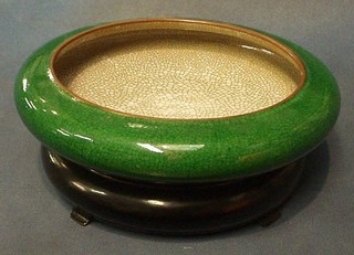 An Oriental green crackle glazed bowl 11" on a hardwood stand