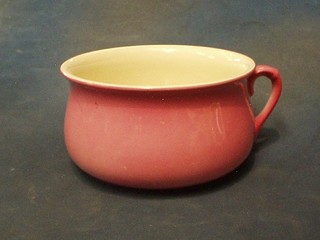 A pink glazed chamber pot