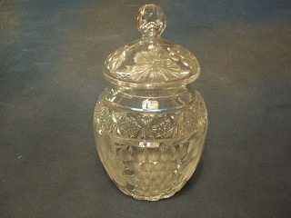 A cut and etched glass biscuit barrel decorated fruit 10"