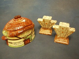 A Burlington Cottageware biscuit barrel and 2 Art Deco pottery candlesticks