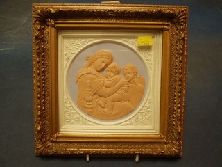 An Italian terracotta plaque depicting Madonna and 2 children 5" circular in a gilt frame