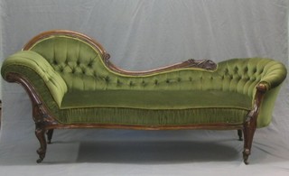A Victorian mahogany show frame chaise longue with shaped outline, upholstered in green buttoned back material and raised on cabriole supports 78"