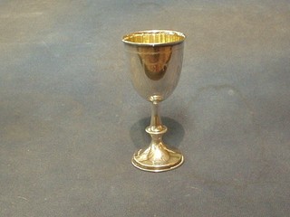 An engraved silver goblet London 1908, raised on a circular spreading foot, 3 ozs