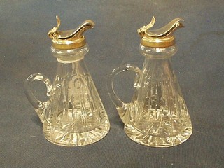 A pair of tapering cut glass whiskey tots with silver mounts