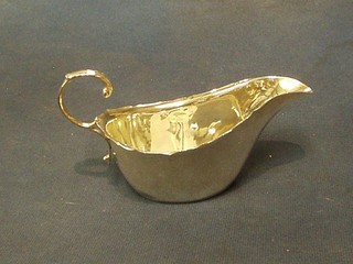 A silver sauce boat with C scroll handle, Birmingham 1931, 2 ozs