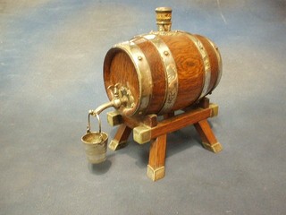 An oak coopered spirit barrel with silver plated mounts