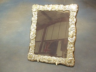 A modern embossed silver easel photograph frame 10" (stand f)