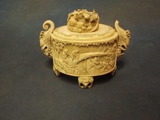 An Oriental oval carved ivory twin handled trinket box  with panelled decoration 7" (handle f)