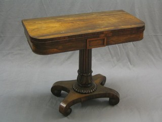 A William IV rosewood card table, raised on a turned and reeded column with triform base, (top reduced in dimension and missing some beading and veneer to the sides) 36"