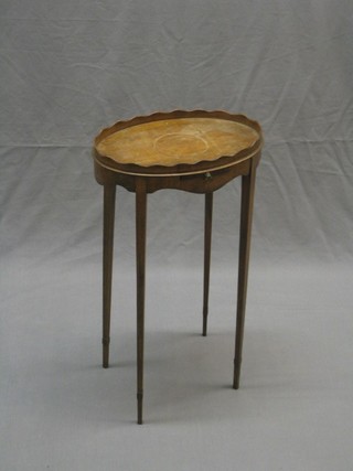 A Georgian style oval mahogany urn table complete with slide, raised on square tapering supports ending in spade feet 14" (somewhat bleached)