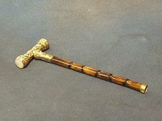 A handsome gilt metal and bamboo parasol handle