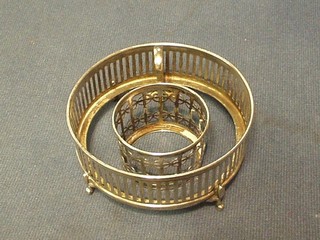 A circular pierced silver butter dish frame London 1919 and a pierced silver cup holder Sheffield 1916