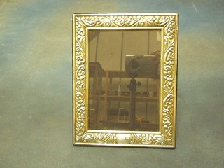 A rectangular embossed silver plated easel photograph frame 5"