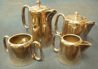 A 4 piece silver plated hotelware tea service comprising teapot, hotwater jug, twin handled sugar bowl and cream jug